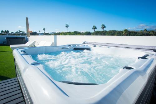 a jacuzzi tub on top of a house at MAR BIANCO - Gay Men Only in Maspalomas