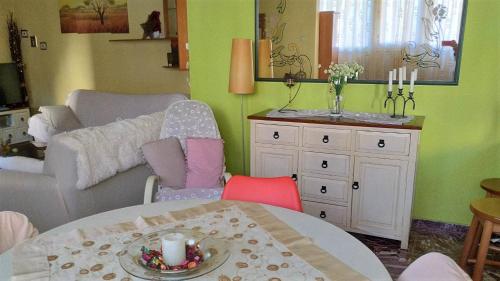 a living room with a table and a couch at Comfortable Central Appartment by a park in Larisa