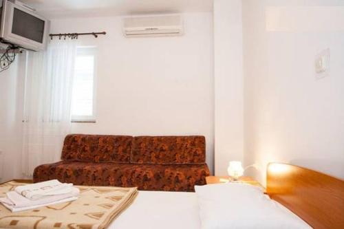 Un pat sau paturi într-o cameră la Apartment Bionda