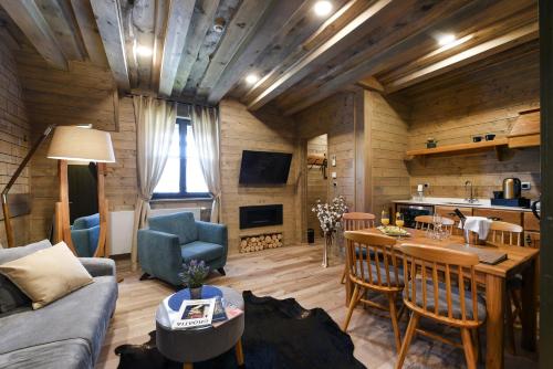 a living room with a couch and a table at Lakeside Hotel Plitvice in Plitvička Jezera