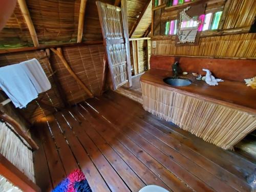 an overhead view of a bathroom in a cabin at Derek's Place Eco-Lodge in Little Corn Island