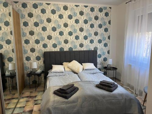 Postel nebo postele na pokoji v ubytování Móriczka Apartman