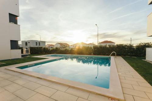 a swimming pool in the backyard of a house at Best Houses 23 - Surf & Chill Apartment Baleal in Ferrel