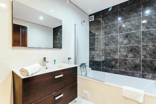 a bathroom with a sink and a shower at Best Houses 23: Stunning Apartment, Great Location in Ferrel