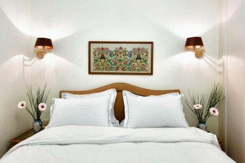 Ένα ή περισσότερα κρεβάτια σε δωμάτιο στο Acropolis Luxury House