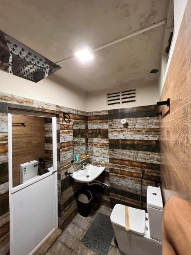 a bathroom with a sink and a toilet at Ceylon Resort in Wilpattu