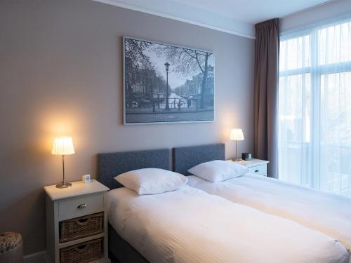 Säng eller sängar i ett rum på BizStay Park Central Apartments