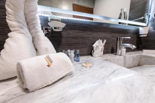 a bathroom with a sink and a towel on a counter at JTowers in Mexico City
