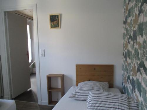 a bedroom with a bed in a room at Gîte les Bois in Orcival