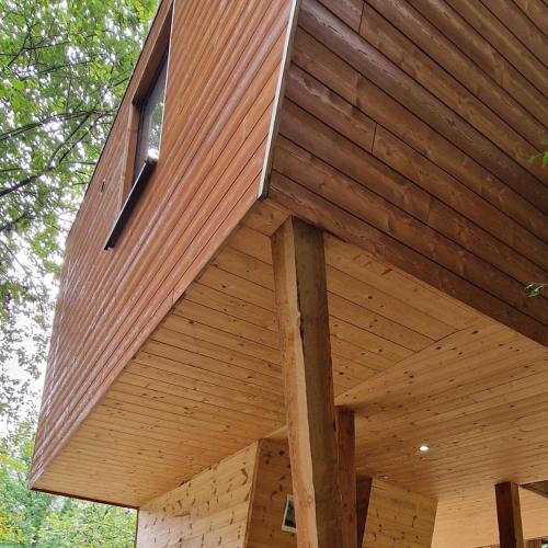 a roof of a wooden building with a window at Utopia Village - Art & Nature Lodges in Mons