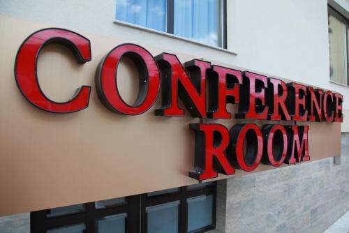 a sign on the side of a corner of a store at Hotel Majestic in Iaşi