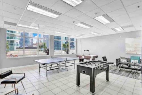 a large room with two tables and chairs in it at Amazing cozy Condo in Brickell Miami in Miami
