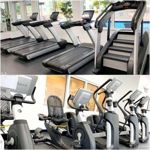 two pictures of a gym with cardio machines at Amazing cozy Condo in Brickell Miami in Miami