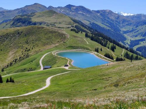 a view of a mountain lake in a valley at Haus Jenewein in Wildschönau