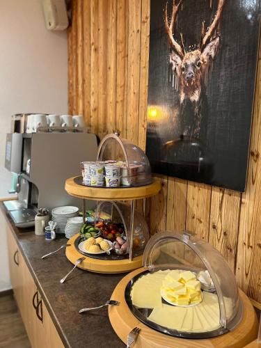a counter with two plates of food on it at Gasthof Löwen in Pfronten