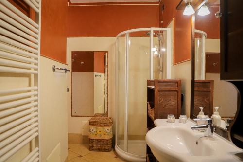 a bathroom with a sink and a shower at Il Cuore del Lago in Lazise
