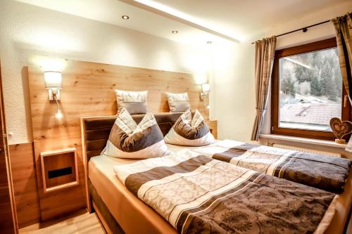 Postel nebo postele na pokoji v ubytování Gasthof Geraerhof