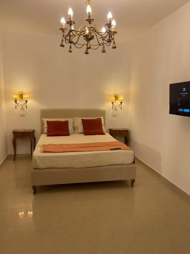 Ένα ή περισσότερα κρεβάτια σε δωμάτιο στο PALAZZO MAZZINI 1