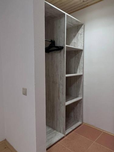 a closet with wooden shelves in a room at Hillside in Slavske