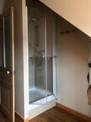 a bathroom with a shower with a glass enclosure at B&B La Villa L'Escale in Audresselles