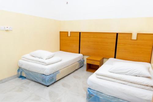 Cama o camas de una habitación en Al Ghaba Line Hotel
