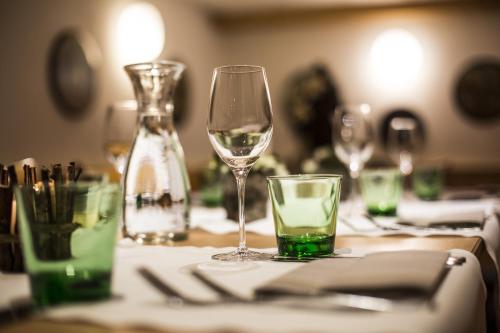 a table with wine glasses and a bottle on it at all inclusive Hotel Lohmann in Obergurgl