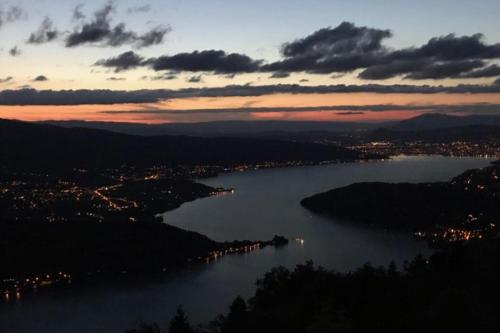 a view of a body of water at sunset at Le pavillon du lac in Duingt