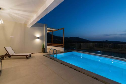 a swimming pool in a house with a view at Kambos Nature View Villa in Périon