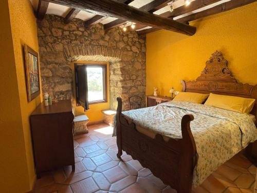 Säng eller sängar i ett rum på Mas Feliu Turismo Rural