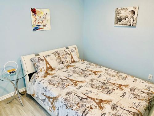 a bedroom with a bed and two pictures on the wall at Artsy home by Air Force Academy with office space in Colorado Springs