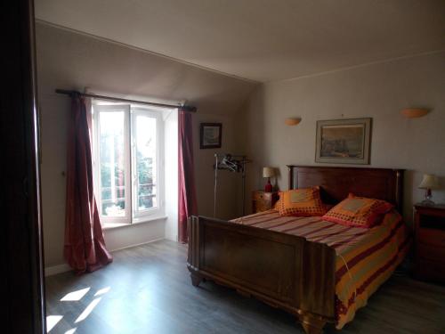 Ένα ή περισσότερα κρεβάτια σε δωμάτιο στο Ker Francozen Renaudière