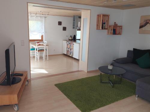 a living room with a couch and a table at Urlaub an der Grenze in Lauterbach