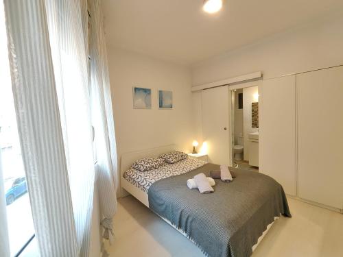 Cama o camas de una habitación en Family apartment close to Parc Güell