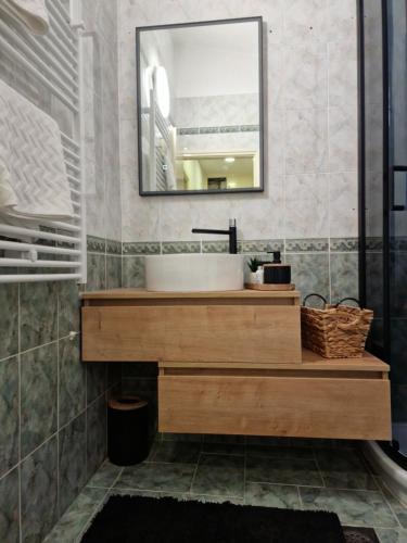 a bathroom with a sink and a mirror at Formin - Lux Apartment in Zadar