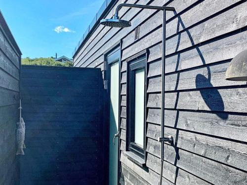 a building with a window on the side of it at 10 person holiday home in Asn s in Asnæs