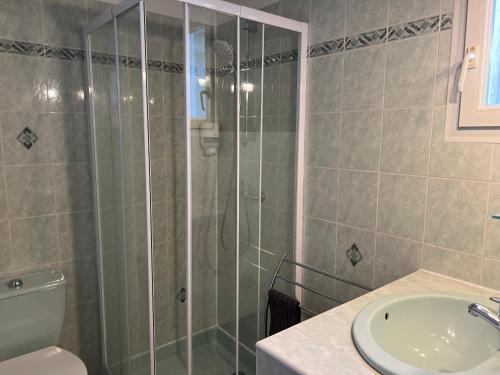 a bathroom with a shower and a toilet and a sink at La Halte Gourmande in Vachères