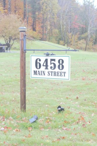 a sign for a main street in a field at Stanford House in Manchester Center