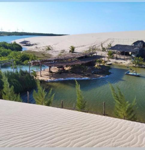 a view of a body of water with a beach at Pousada Recanto das Flores in Praia de Moitas