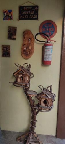 a wall with a bunch of objects on a wall at Pousada Nordestina in Recife