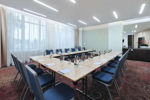 a large conference room with a long table and chairs at Radisson Blu Sobieski in Warsaw