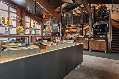 a bakery with a counter with food on it at Stoten Ski Hotel in Stöten