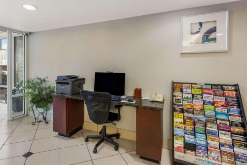 an office with a desk with a computer and a monitor at Revival Scottsdale Studios in Scottsdale