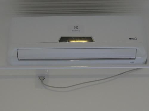 a close up of a white microwave oven at BORA BORA RESIDENCE in Joinville