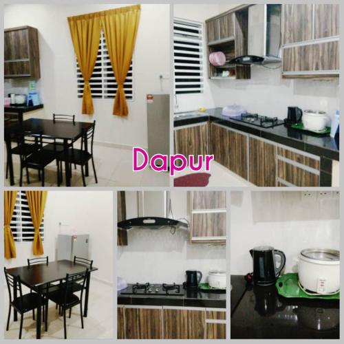 a kitchen with a table and a dining room at Homestay Haji Din Tronoh Perak in Teronoh