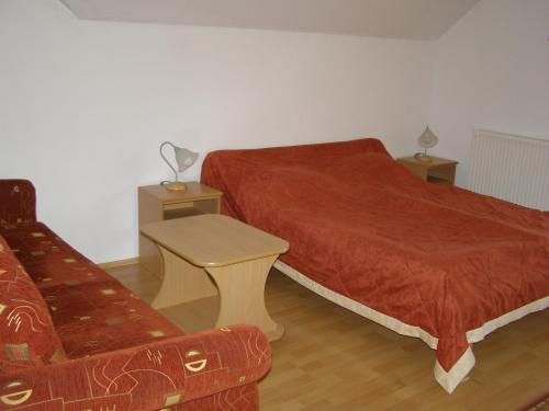 Säng eller sängar i ett rum på Harkány-Szt. István Apartman