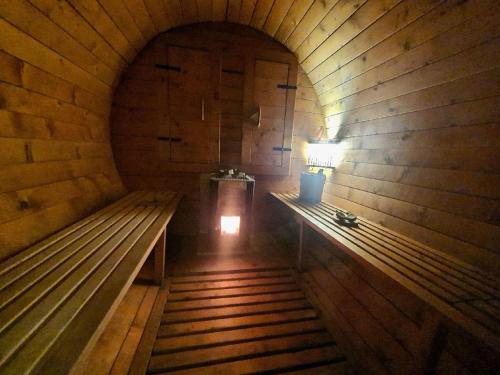 a small room with two benches and a lamp at Charming Escape in Modigliana in Modigliana