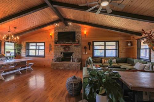 a living room with a couch and a fireplace at Bells With a View in Sevierville