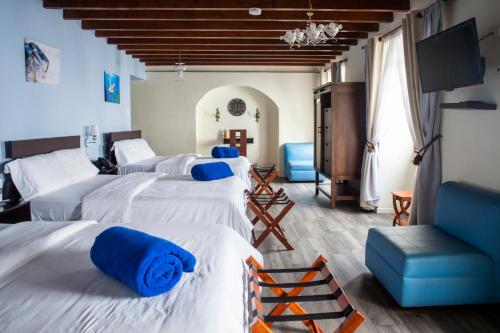 Postel nebo postele na pokoji v ubytování Hotel Colonial San Agustin