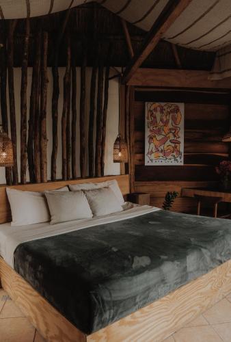 a bedroom with a large bed in a room at BOA BOA Bacalar in Bacalar
