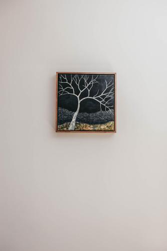 a painting of a tree on a wall at Mopsy's On The Esplanade in Wagga Wagga